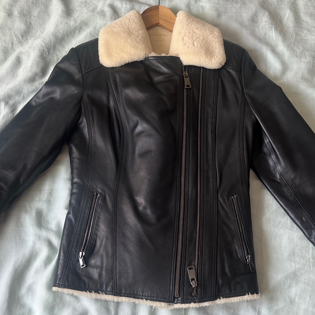 Elegant Black Leather Jacket With Cream Collar